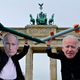 Peace activists wearing masks of Russian President Vladimir Putin (L) and President Joe Biden pose with mock nuclear missiles in front of Berlin’s landmark the Brandenburg Gate on January 29, 2021 in an action to call for more progress in nuclear disarmament.